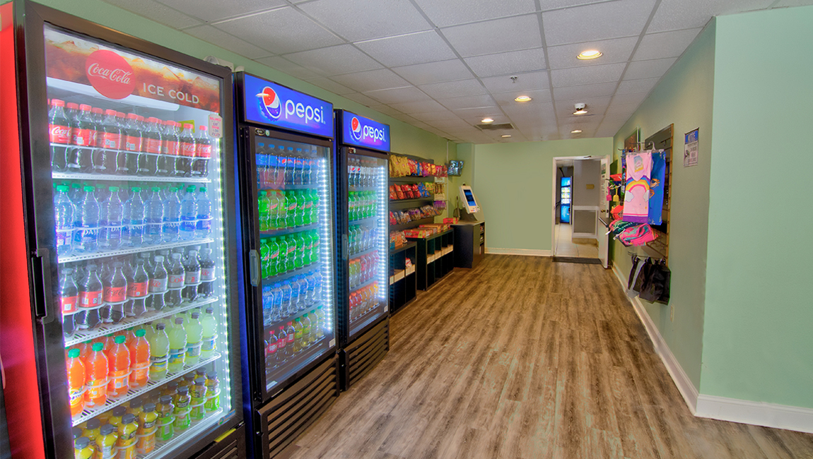 a convenience store with refrigerators and snacks